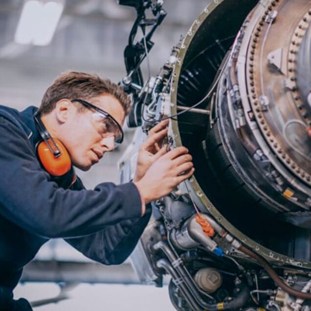 Engineer working on mechanical part