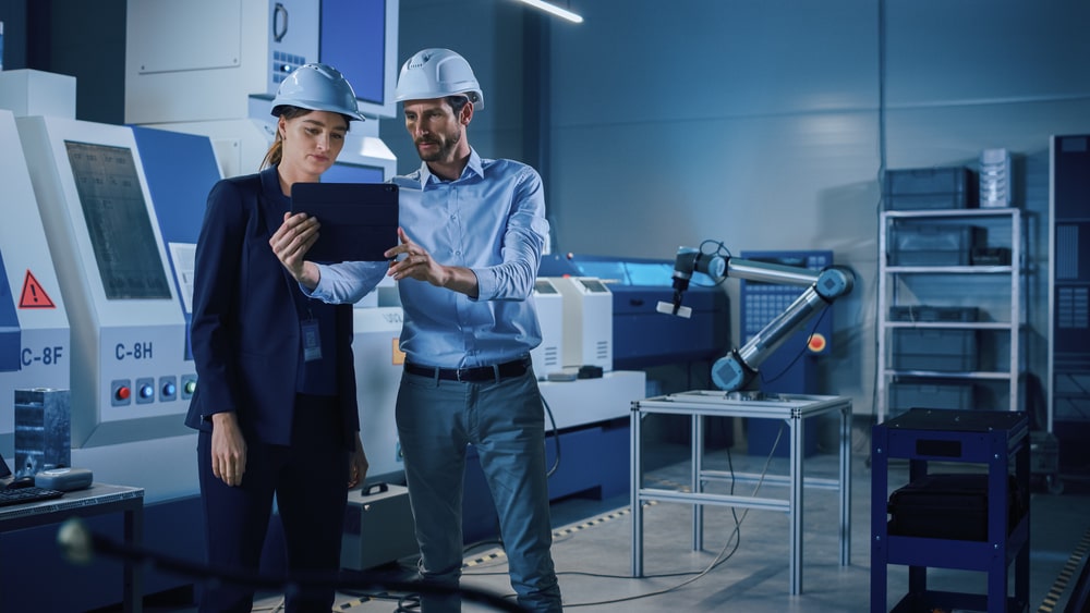 Two people looking at a tablet