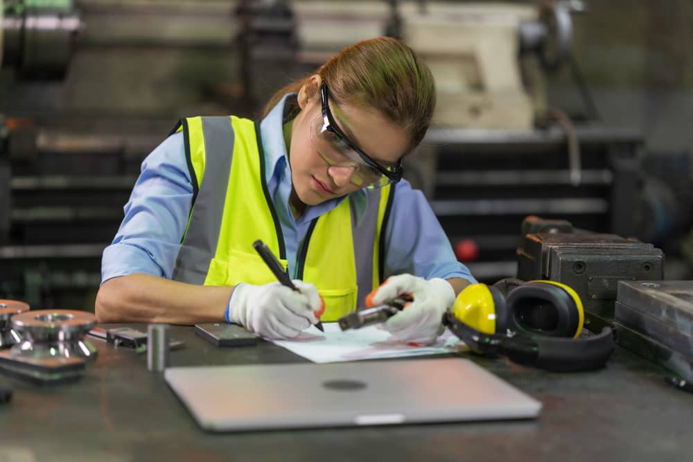 Geometric Dimensioning and Tolerancing Woman Measuring parts