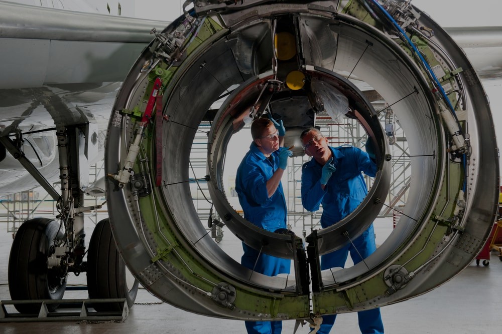 Men inspecting airplane